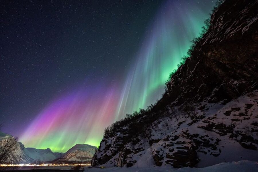 From Tromsø: Aurora Minibus Chase with Portrait and Hot Meal - Camp life with a bonfire, hot meal, and a heated toilet tent