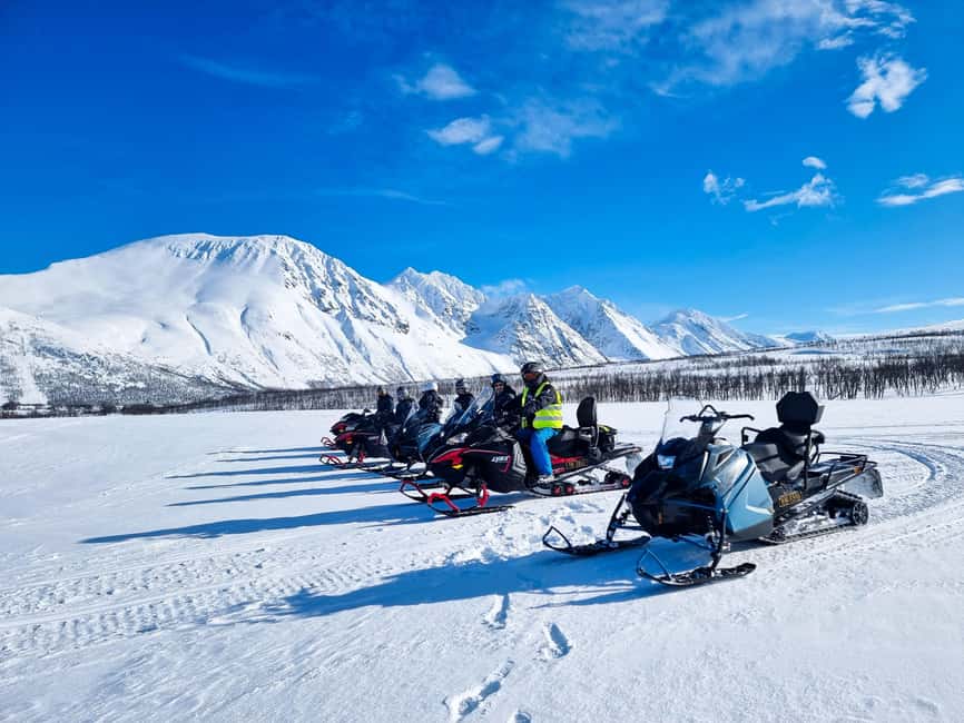 From Tromsø: Lyngen Alps Guided Snowmobile Tour - The snowmobile ride itself: safari-style, approved trails, and photo stops
