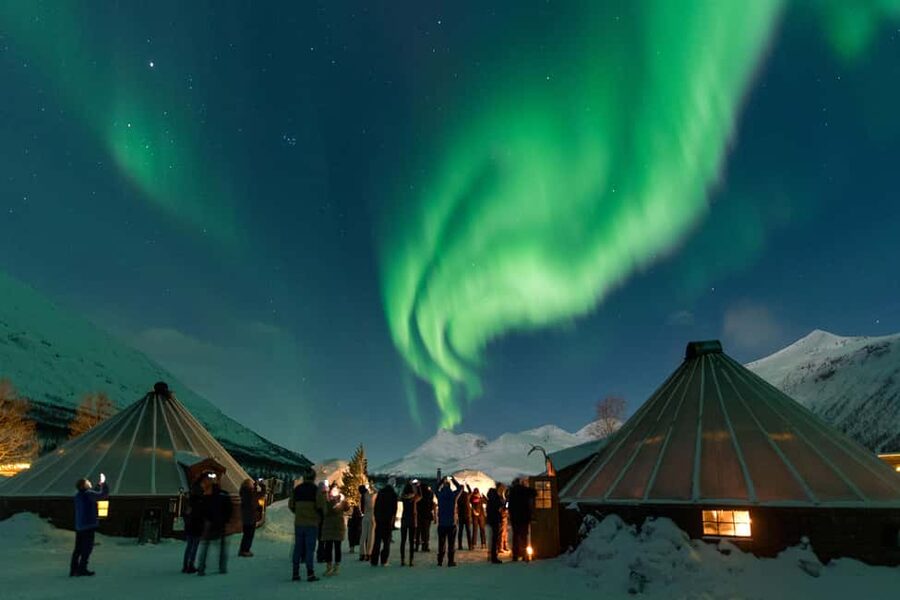 From Tromsø: Northern Lights Visit at Camp Tamok - Gear check at the camp: thermal suit, boots, headlamp, and tripod