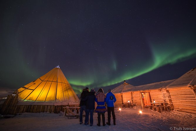 Night Reindeer Sledding with Camp Dinner and Chance of Northern Lights - Inside the candlelit Gamme: dinner, joiking, and Sami stories