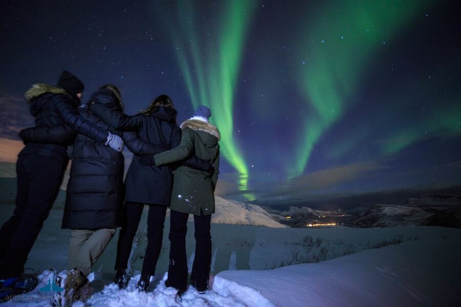 Tromso: Northern Lights Chase with Photo Package Included - Cold weather comfort: hot drinks, cookies, and the bus you can run back to